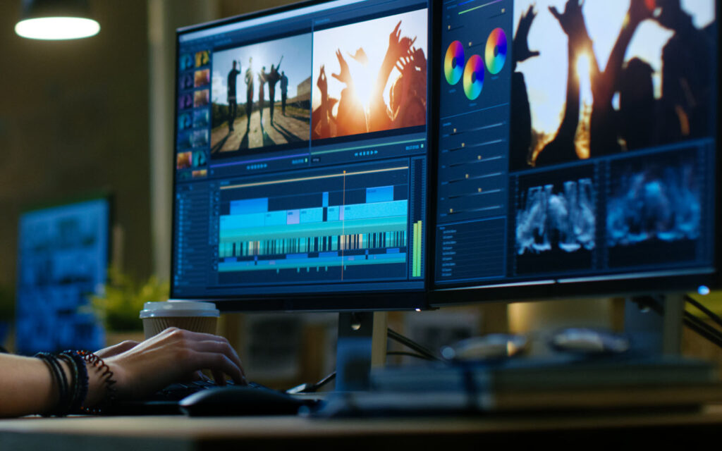 Student editing video on professional software during a video editing course."