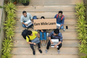 Students holding Earn While You Learn sign discussing work and study MBA program in Mumbai